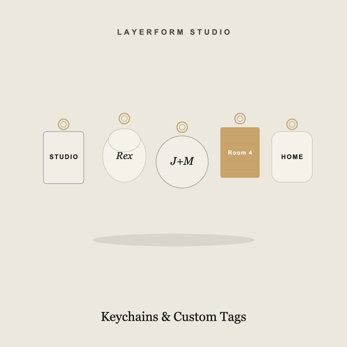 Custom laser-cut keychains and pet tags in acrylic and wood by LayerForm Studio