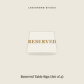 Clear acrylic reserved table tent card with gold fill by LayerForm Studio