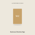 Engraved wood restroom direction sign by LayerForm Studio